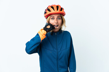 Young blonde Uruguayan cyclist woman isolated on background making phone gesture. Call me back sign