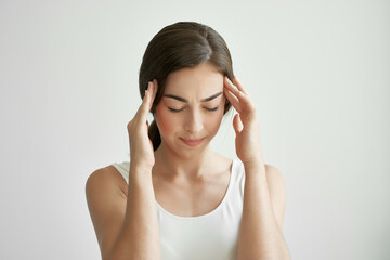 woman holding her head migraine health problems stress negative