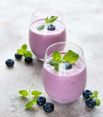 Glasses of blueberry yogurt with blueberries