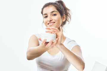 woman with cream on her hands skin care cosmetics dermatology