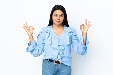 Young latin woman woman isolated on white background in zen pose