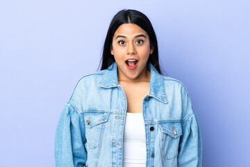 Young latin woman woman over isolated background with surprise facial expression