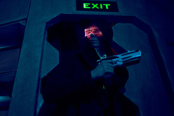 Fototapeta na wymiar Man with blaster in the futuristic battle. Concept virtual reality, cyber game.