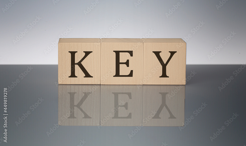 Poster key word made with building blocks isolated on grey background