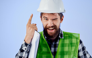 man in construction uniform helmet construction technology blueprints blueprints