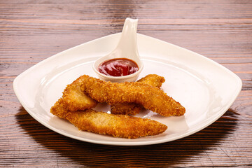 Fried chicken strips with sauce