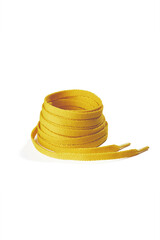 Subject shot of yellow shoe strings with thin tips. Flat shoe laces are rolled into coil and isolated on the white background.