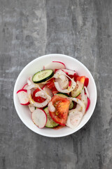 fresh vegetable salad in white small bowl