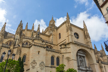 Amazing detailed front facade view at the iconic spanish gothic building at the Segovia cathedral, towers and domes, downtown city