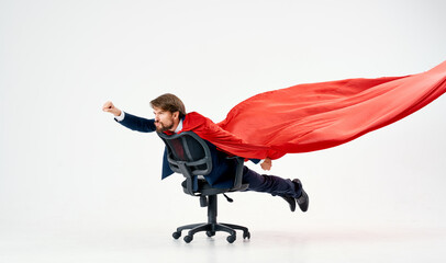 business man with red cloak in the chair hero superman