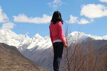 woman on the top of mountain