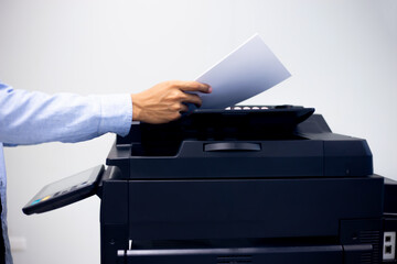 Bussiness man Hand press button on panel of printer, printer scanner laser in office copy machine...