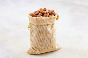 Raw Organic cranberry bean on white background.