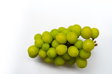 Fresh ripe juicy sweet green grapes  brunch fruit on isolated white background.