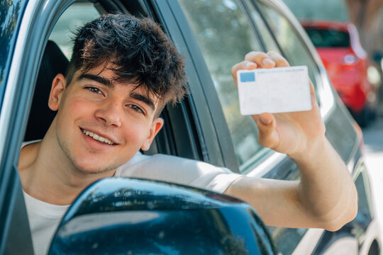 young nobel in the car with driver's license