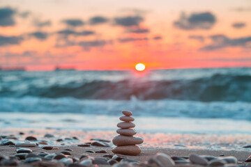 Stones balance on the beach. Beautiful sunrise and sea landscape for relaxation and meditation.