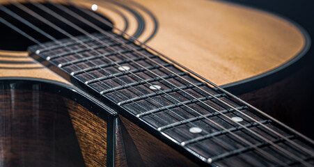 Fototapeta premium Close-up of a classical acoustic guitar in beautiful lighting.