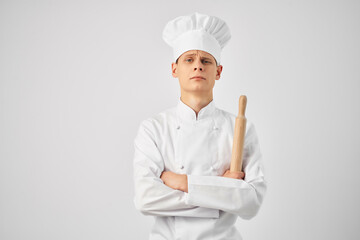 man in chef uniform kitchen profession work light background