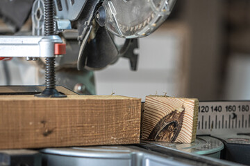 Close-up of a miter saw in a carpenter's workshop.