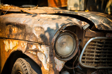 Fototapeta na wymiar Old broken rusty car. Rust on metal of vintage automobile