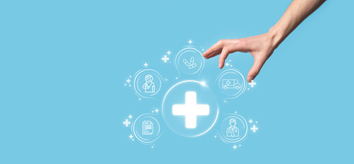 Businessman hold virtual plus medical network connection icons. Covid-19 pandemic develop people awareness and spread attention on their healthcare.Doctor,document,medicine,ambulance,patient icon.