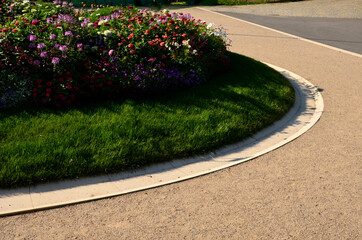 annual flowerbed in a formal park of rectangles in the lawn. perfect connected flower bed at the...