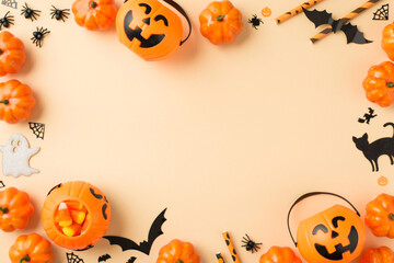 Top view photo of halloween decorations pumpkin baskets candy corn straws spiders web bats ghost...