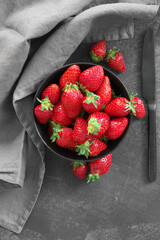 Fresh strawberries in bowl on grey - 449830686
