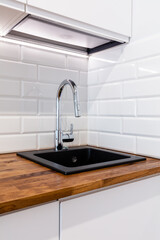 New clean kitchen with wooden table top