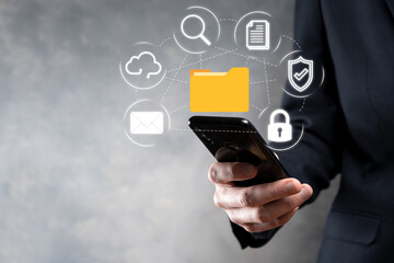 Document Management System DMS .Businessman hold folder and document icon.Software for archiving, searching and managing corporate files and information.Internet Technology Concept.Digital security