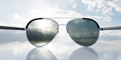 Polarized sunglasses on sunny sky UV protection