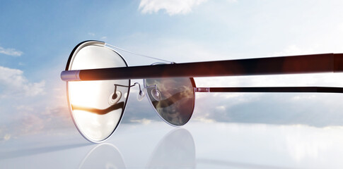 Polarized sunglasses on sunny sky UV protection