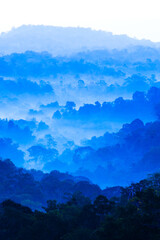 Scenery of blue mountains in the morning mist.