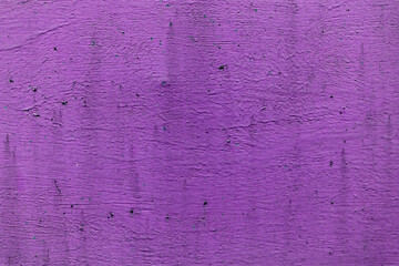 Purple paint on wooden background