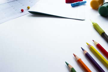 School  stationery on white background. Back to school creative layout, template with copy space. Flat lay, top view, overhead. Article about preparing for the school year. 
