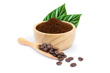 Roasted coffee beans in scoop and coffe powder (ground coffe) in wooden bowl with green leaf isolated on white background. 