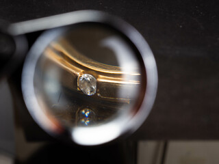Close up shoot of gold wedding ring with beautiful diamond