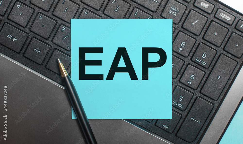 Poster the computer keyboard has a pen and a blue sticker with the text eap employee assistance program. fl