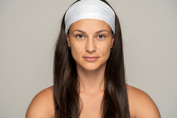 Portrait of a young woman without makeup and headband