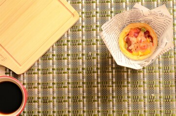 Delicious homemade egg tart pizza and hot coffee cup backgrounds
