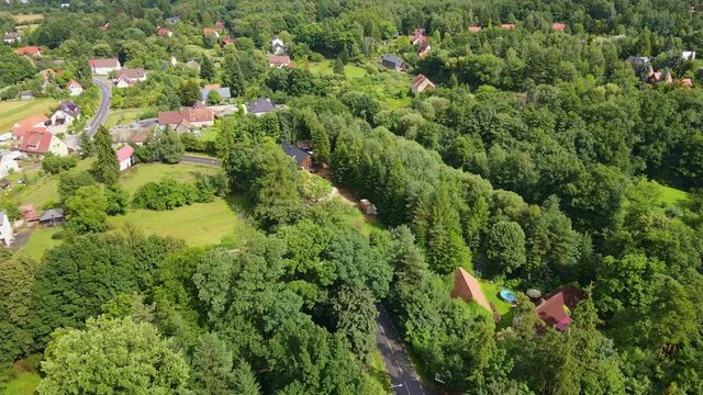 Mountain village with forests, bird eye view. Sleza mountain landscape near Wroclaw in Poland. Nature background, aerial view.