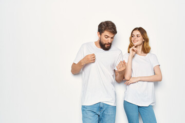 Fototapeta premium man and woman wearing white t-shirts fashion studio design casual wear