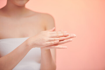 Beautiful woman's hands on the biege background