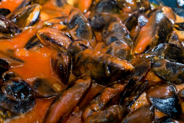 close-up of natural mussels cooked with tomatoes