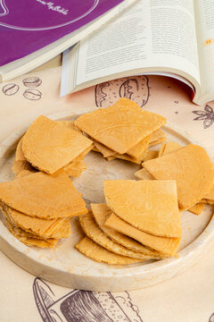 Kue semprong  is an Indonesian traditional wafer snack made by clasping egg batter using an iron mold which is heated up on a charcoal stove. The taste of this cake is not too sweet and will be crunch