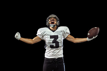 Portrait of American football player equipment helmet and gloves isolated on dark studio background. Concept of sport, competition, goals, medal, win