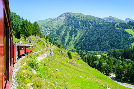Steam locomotive rides by rail. Switzerland. Furka region.