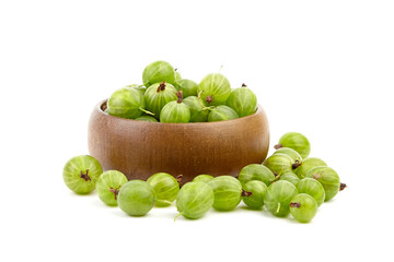 Gooseberry in wooden bowl isolated on white background. Green summer berries