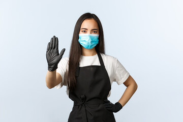 Covid-19, social distancing, small coffee shop business and preventing virus concept. Serious asian...