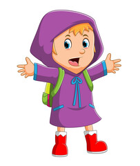 The happy girl is going to school with the cute raincoat